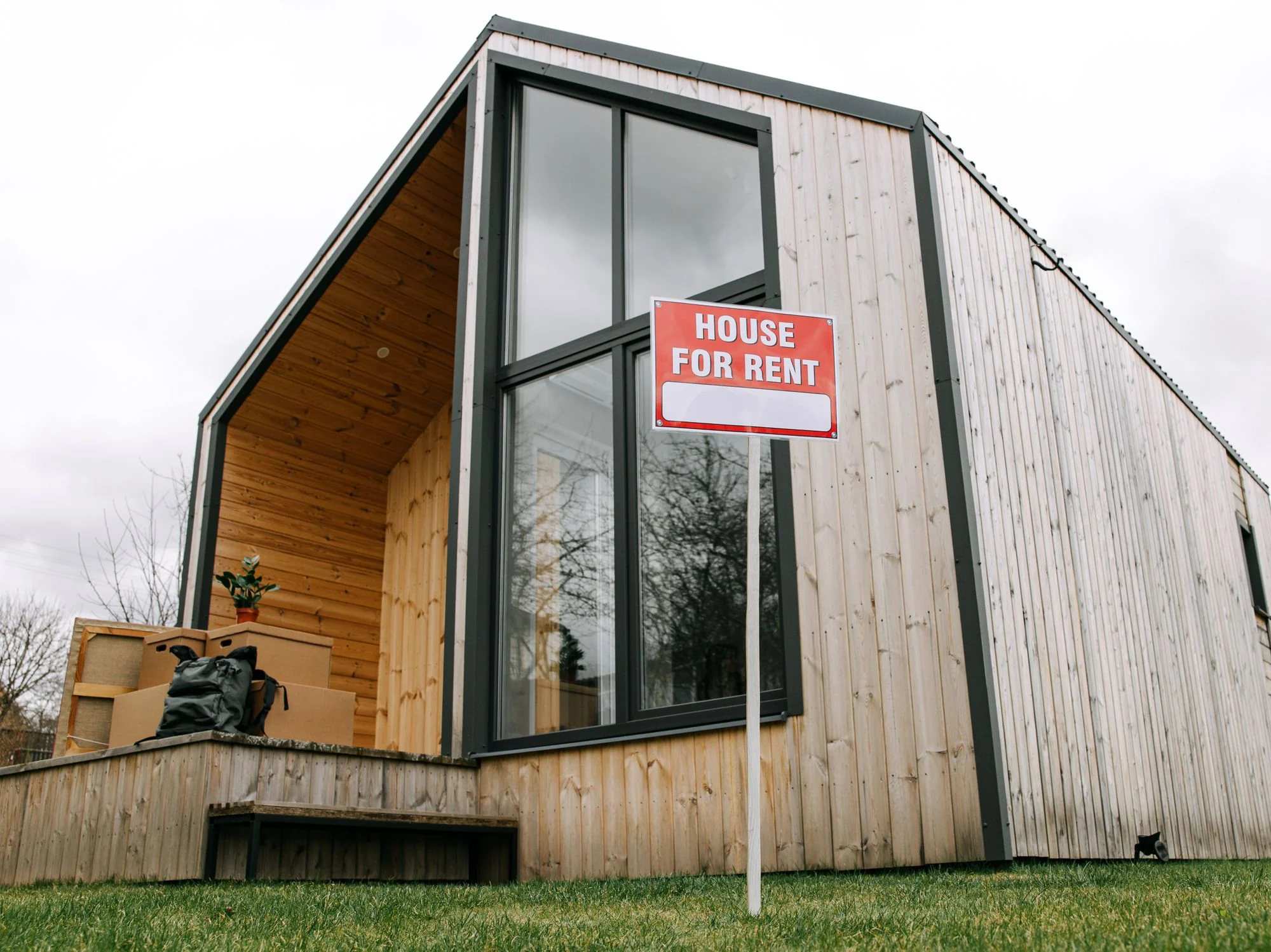 A rental house with a clearly visible House for Rent sign outside
