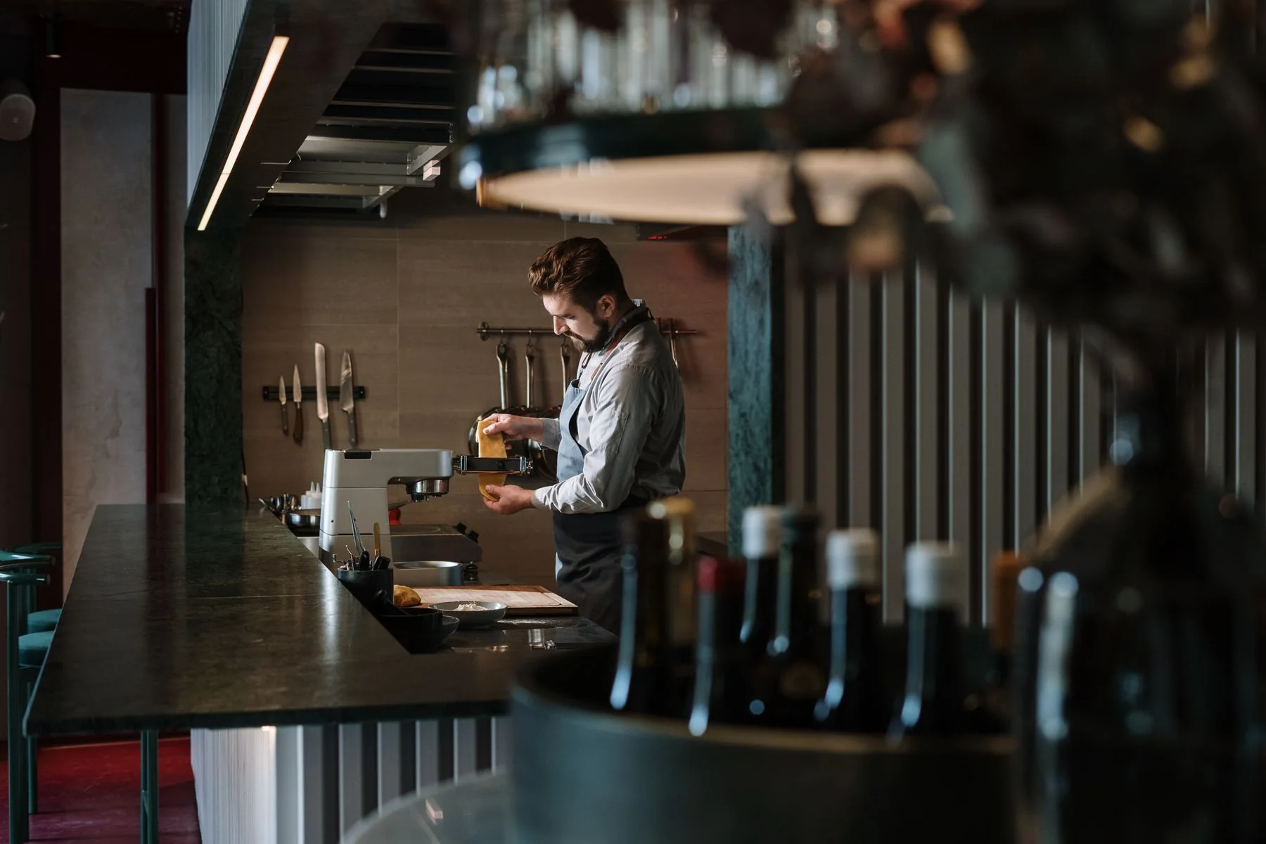 A chef preparing food in a restaurant kitchen